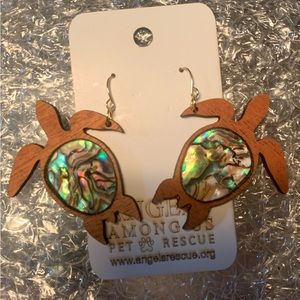 Handmade wooden and natural material sea turtle earrings.